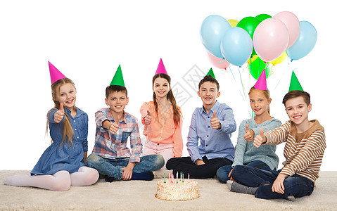 童,假期,友谊人的快乐的微笑孩子戴着生日蛋糕气球,竖大拇指图片