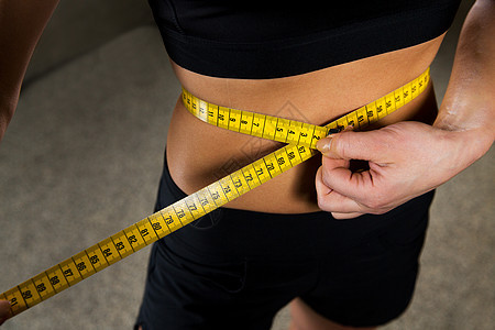 运动,健身,减肥,饮食人的密切妇女测量腰部大小的磁带健身房图片