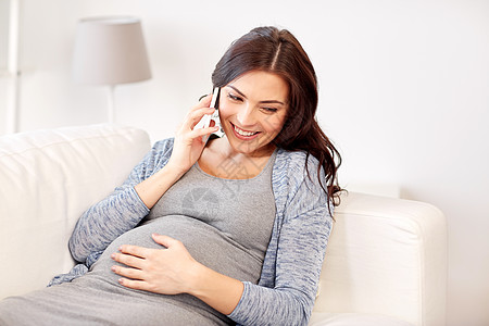 怀孕,母亲,技术,人期望快乐的孕妇打电话家里的智能手机图片