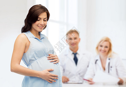 孕妇和小孩怀孕,母亲,人,医学生育快乐的孕妇触摸她的大肚子妇产医院的背景背景