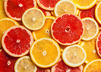 彩色柑橘类水果柠檬,橘子,柚子片背景图片