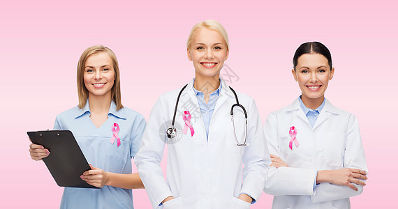 保健,慈善,支持医学女医生与粉红色乳腺癌意识丝带图片
