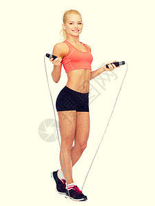 运动,锻炼保健微笑的运动妇女跳绳图片