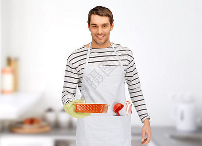 人,烹饪,烹饪食物快乐的人烹饪围裙与烘焙厨房用具家庭厨房背景图片