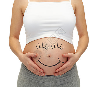 孕妇刷牙怀孕,母亲,人期望密切孕妇触摸她裸露的肚子背景