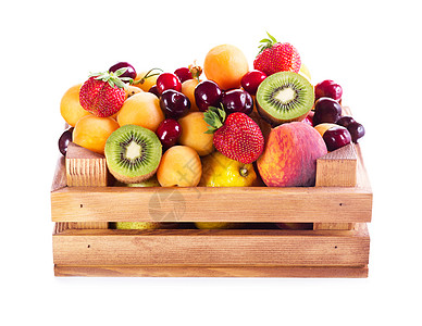 新鲜的各种水果白色背景的木箱里图片