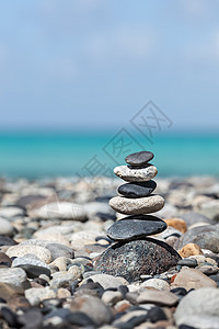 禅宗冥想背景平衡的石头堆叠海边图片