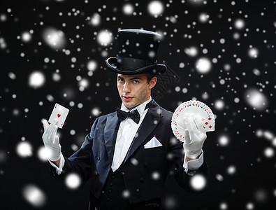 魔术,表演,马戏,扑克,表演魔术师戴着顶帽表演扑克牌背景图片