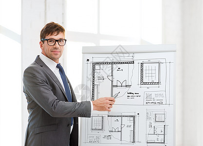 商业,办公,建筑,发展,建筑建筑商人指向蓝图的翻板办公室图片