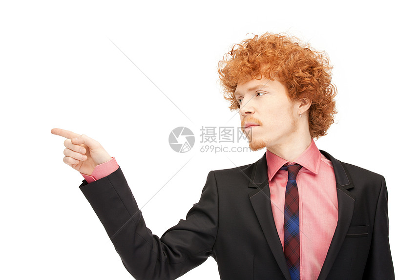 吸引人的商人指着他的手指的照片