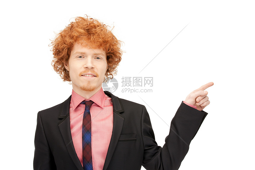 吸引人的商人指着他的手指的照片