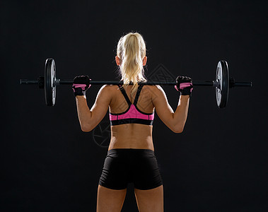 健身,运动节食的运动的女人后用杠铃锻炼图片