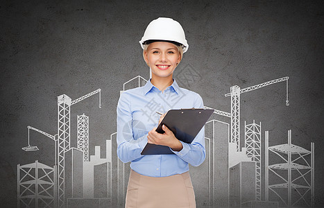 建筑,发展,建筑建筑微笑的女商人头盔与剪贴板个建筑项图片