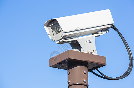 保护隐私带蓝天的安全摄像头闭路电视背景