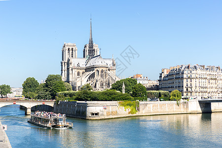旅游游轮河流塞纳河巴黎与大教堂母院香槟图片