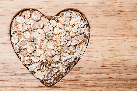 节食保健燕麦麦片心形木表降胆固醇的健康食品图片