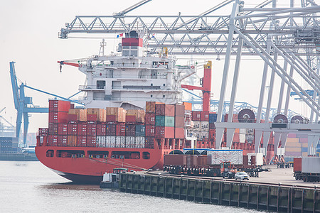 大型货物集装箱船与货物货栈码头码头港口等待国际海运运输鹿特丹港荷兰图片