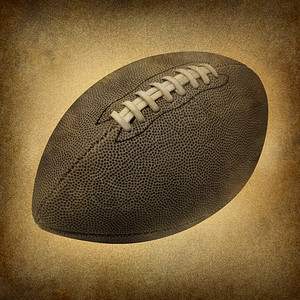 古老的式橄榄球作为古老的董体育标志印在肮脏的纸质背景上作为美国文化和传统民族以及皮革和缝纫运动图片