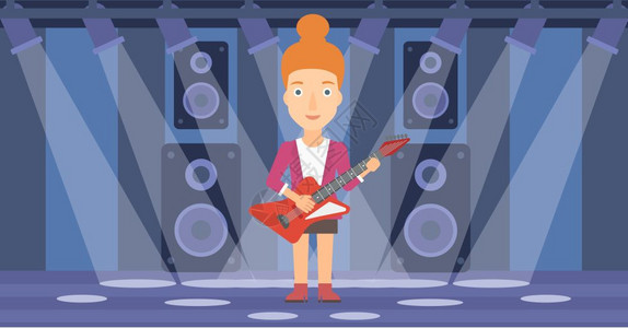 一位在舞台上玩电吉他的女性图片