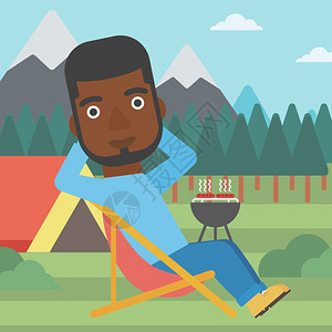 坐在营地折叠椅上的非裔男子图片