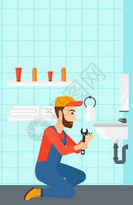 一个长着胡子的工人在浴室里修一个水槽图片