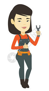 年轻的女修理工手持工具图片