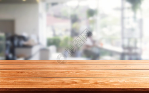 现代餐饮室或咖啡店的木制桌布其背景模糊产品展示型桌上空着复制间室内餐厅柜台设计概念图片