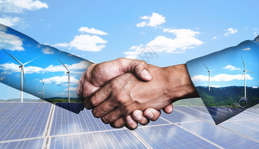 商业界人士在风力涡轮机农场和绿色可再生能源工人界面上握手的双重接触图像图片