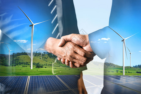 商业界人士在风力涡轮机农场和绿色可再生能源工人界面上握手的双重接触图像图片