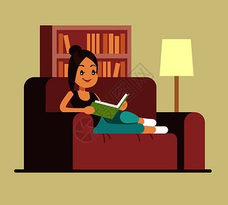 年轻女子在沙发上读书 图片