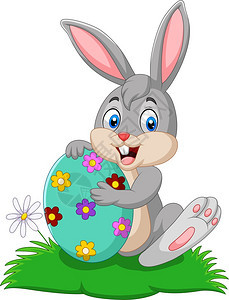 抱着复活节鸡蛋的卡通兔子图片