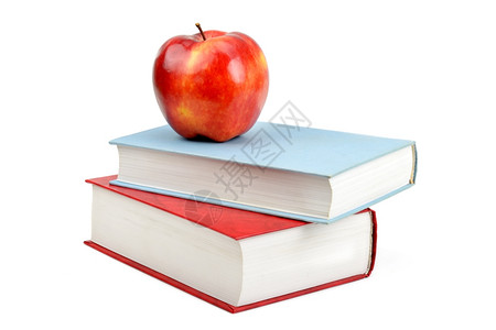 白背景上的红苹果和书籍图片
