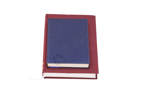 蓝色笔记本放在书上图片
