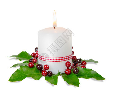 圣诞节成份用燃烧的蜡烛和白背景胡萝卜果图片