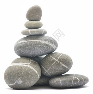 平衡白色背景上孤立的石块图片