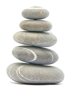 平衡白色背景上孤立的石块图片