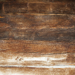 门或谷仓的非常古老的粗糙的棕色风化木板特写图片