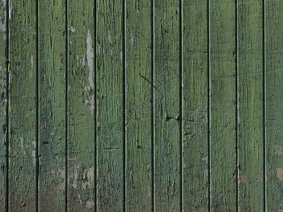 部分旧破的烂绿漆谷仓门与垂直板背景图片