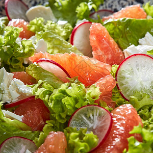 蔬菜水果背景以及素食沙拉的成分新鲜生菜柑橘水果奶酪图片