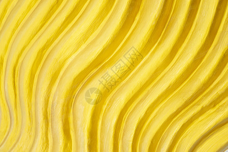 金曲线的抽象背景由墙上装饰的金曲线黄色背景组成图片
