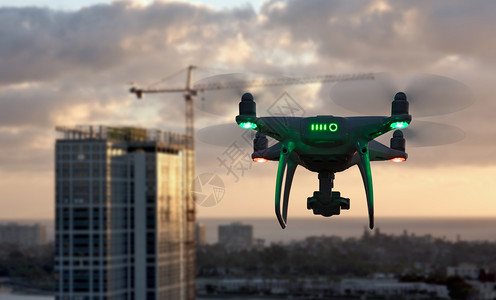 无人驾驶飞在靠近城市和公司大楼的空中飞行图片