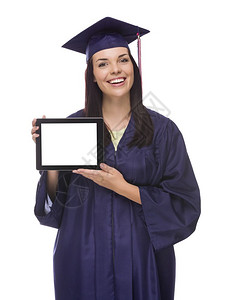 穿着帽子和礼服的快乐混合种族女毕业手持空白的电脑平板孤立在白色的电脑平板图片