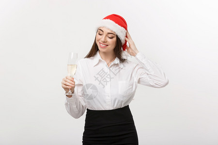 圣诞庆典年轻美丽的商业女人庆祝圣诞节香槟图片