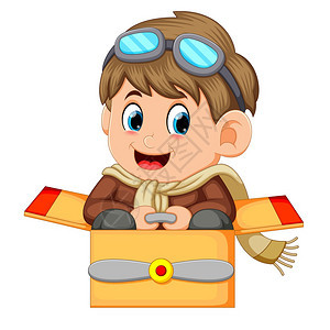 穿着飞行员服装的可爱小男孩玩飞机游戏图片