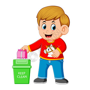 男孩在垃圾桶里用刷子保持清洁环境背景图片