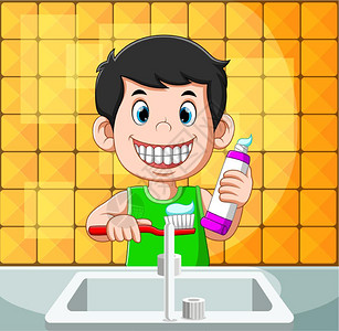男孩笑着用牙膏刷图片