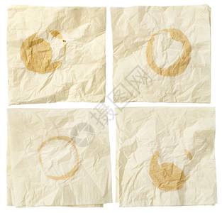 四张纸面巾皱纹白上隔着咖啡污点图片