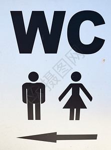 男女在公共厕所的标志用箭向WC洗手间展示方向图片