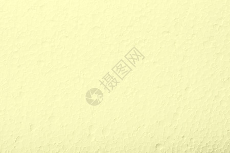 浅黄色聚苯乙烯材料泡沫的背景纹理图片