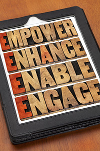 增强扶持和参与激励领导和商业概念数字平板电脑上纸质木印刷型的iord拼图背景图片